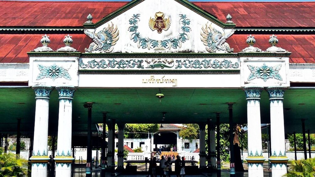 A traditional building with ornate decorations and a red roof. 3