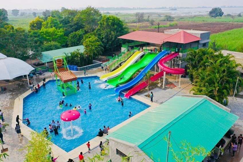 A water park with multiple slides and a central pool. 3