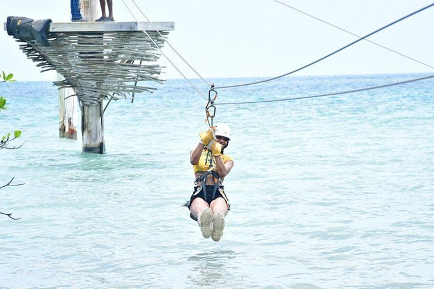 A person bungee jumping from a high platform over water. 5