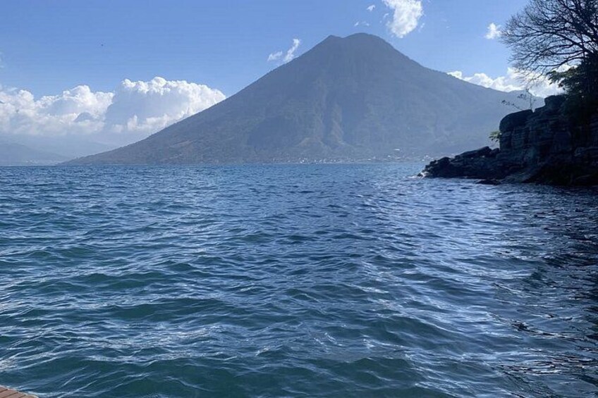 A body of water with a mountain in the background. 2