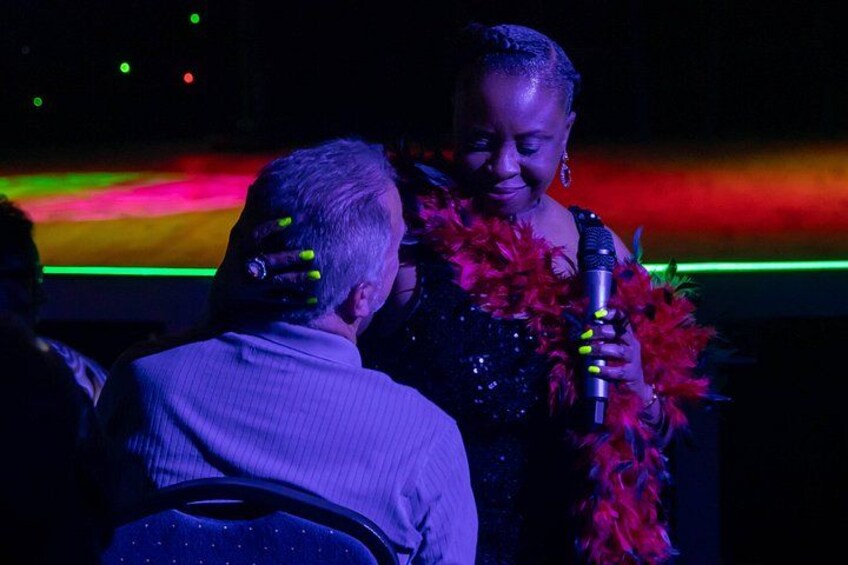 Cast Member interacting with VIP Seating 2