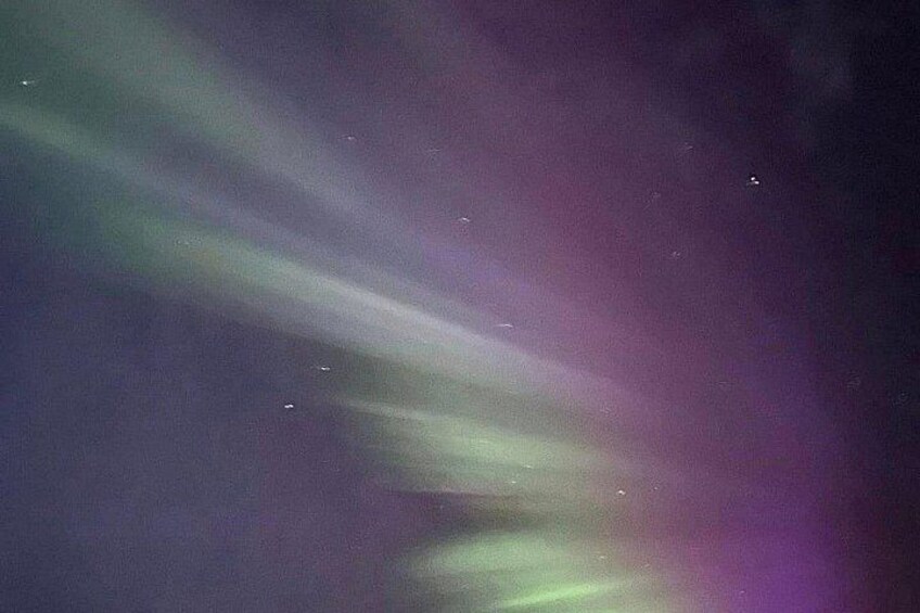 The aurora borealis with green and purple hues. 2