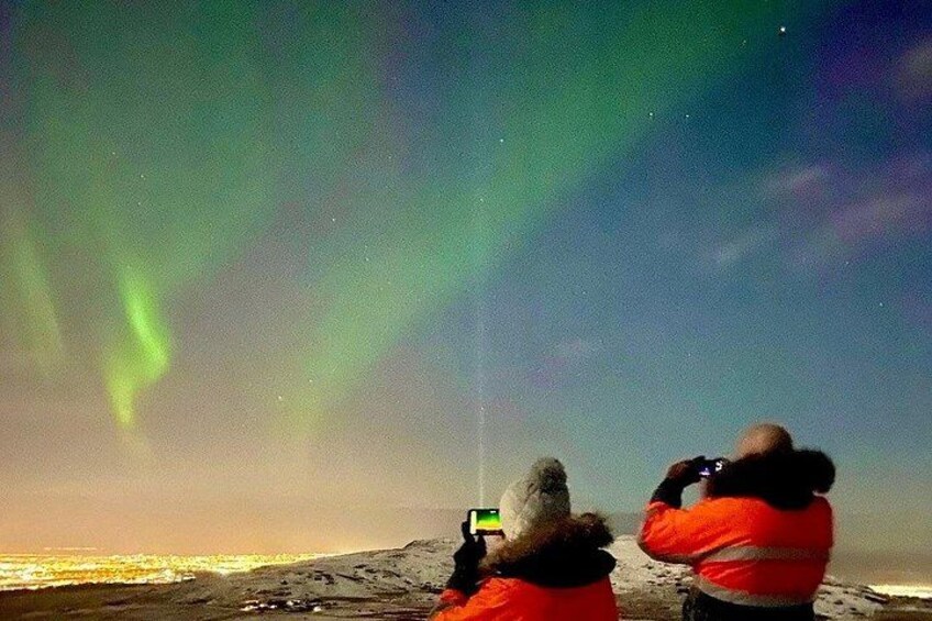 Two people observing the Northern Lights. 4
