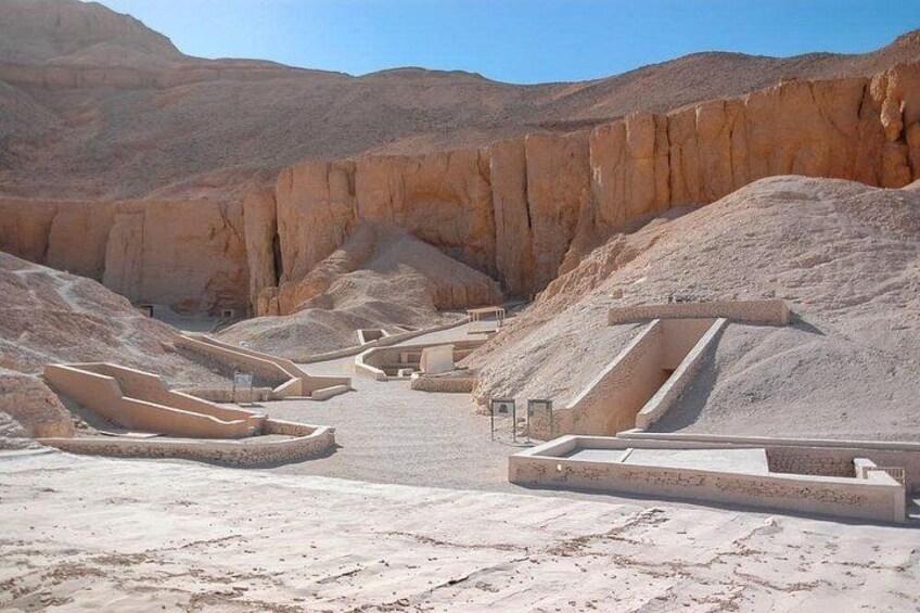 A desert landscape with ancient Egyptian tombs and pyramids. 2