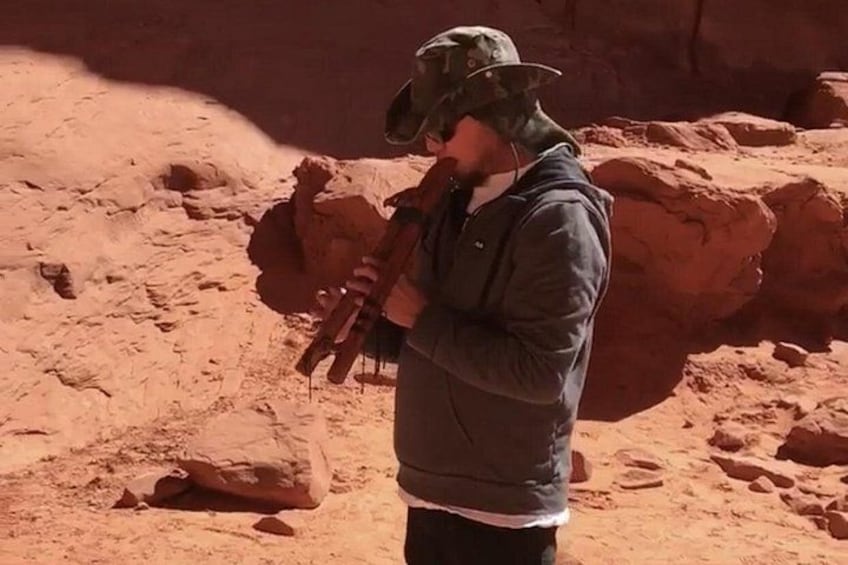 A person standing in a rocky desert landscape. 1