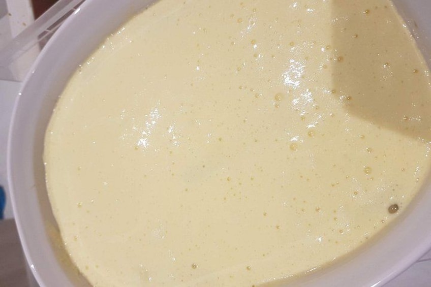 A bowl of thick, creamy batter with a smooth texture. 3
