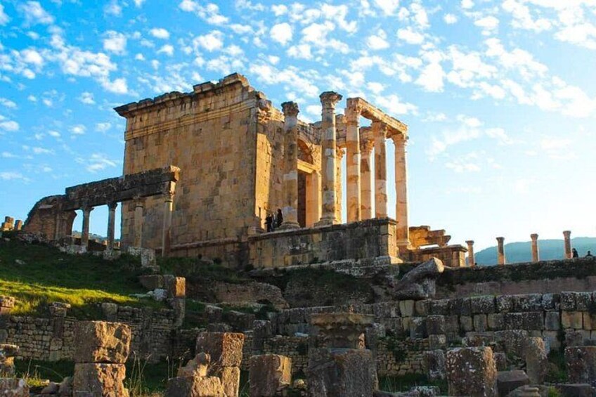 Ancient ruins with columns and stone structures. 3