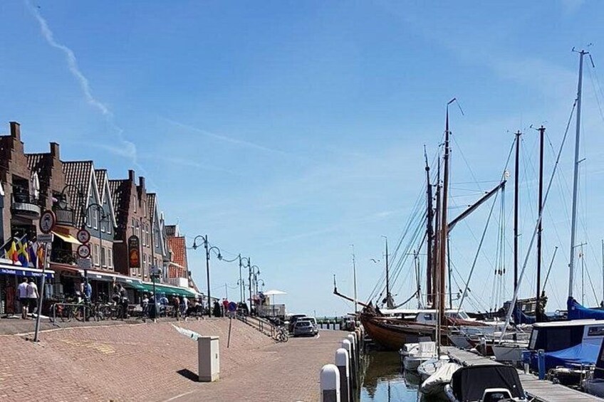 Enjoy a peaceful afternoon stroll through the charming port of Volendam, where you can soak in the scenic views, explore local shops, and savor fresh seafood delights! 5