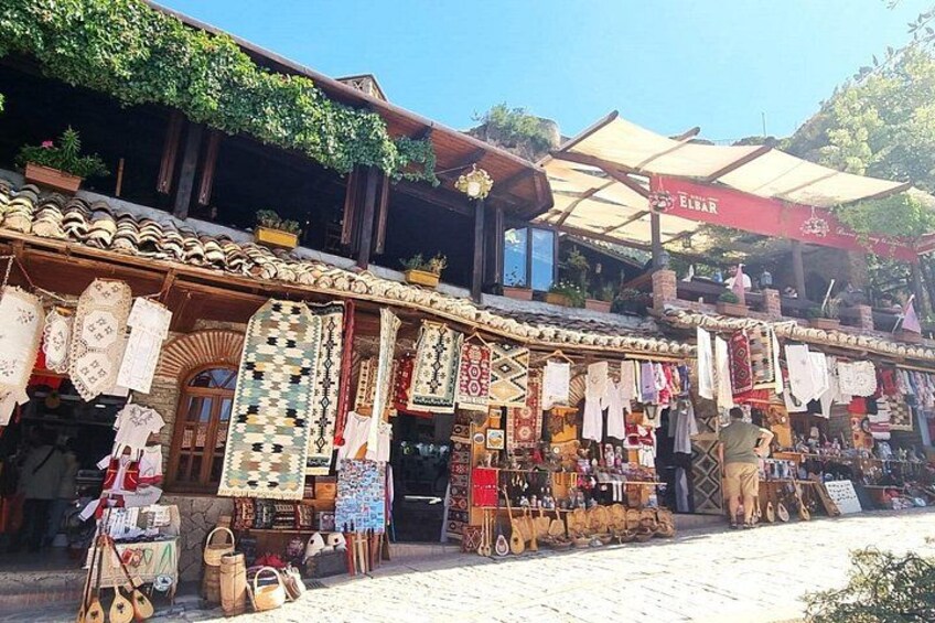A traditional market with handmade textiles and pottery. 4
