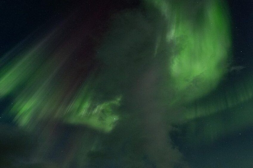 A night sky with green aurora borealis. 4