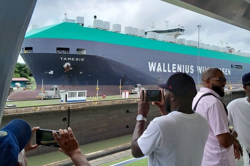 A large ship named TAMESIS WALLENIUS WILHELMEN with people taking photos. 3
