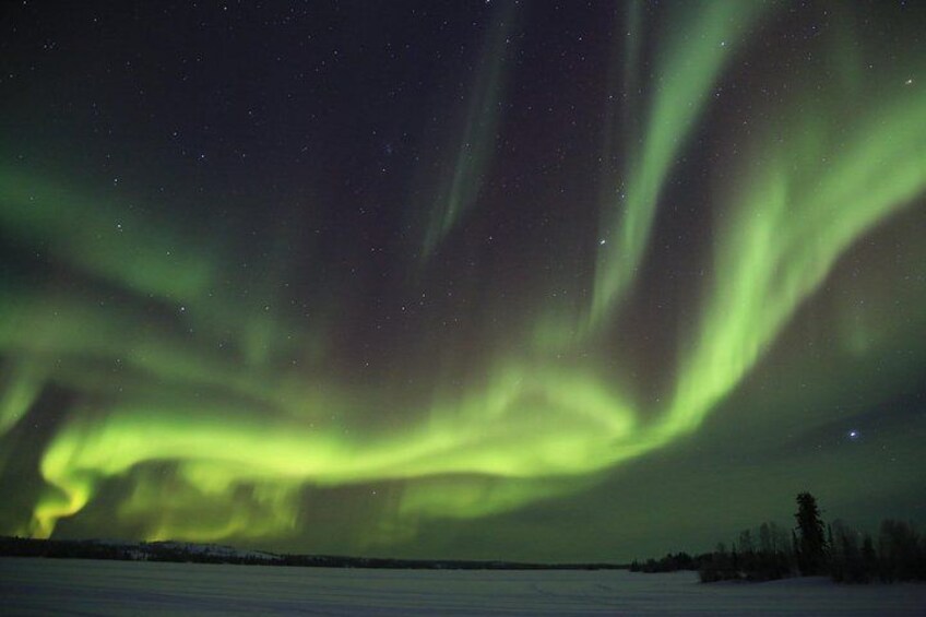 The Northern Lights over a snowy landscape. 2