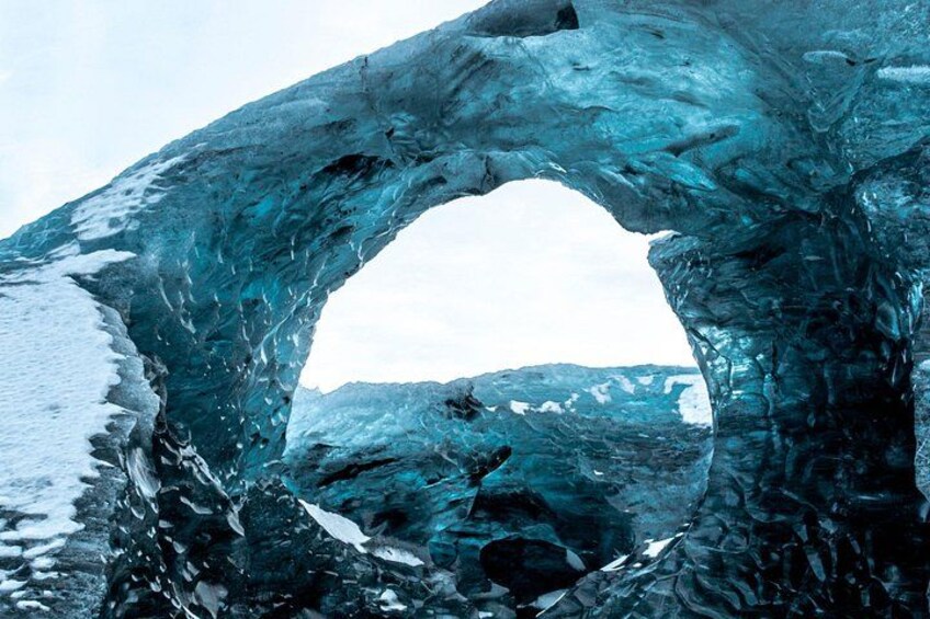 An ice cave with a circular opening. 2