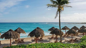 On the beach, sun loungers, beach umbrellas, beach massages