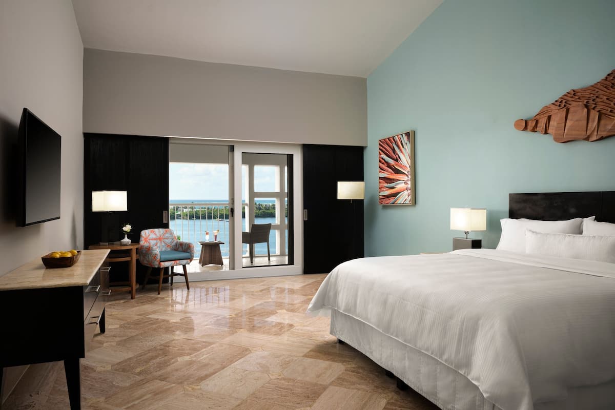 Deluxe Guest Room, 1 King, Lagoon View, Balcony (A) | Pillowtop beds, in-room safe, desk, iron/ironing board