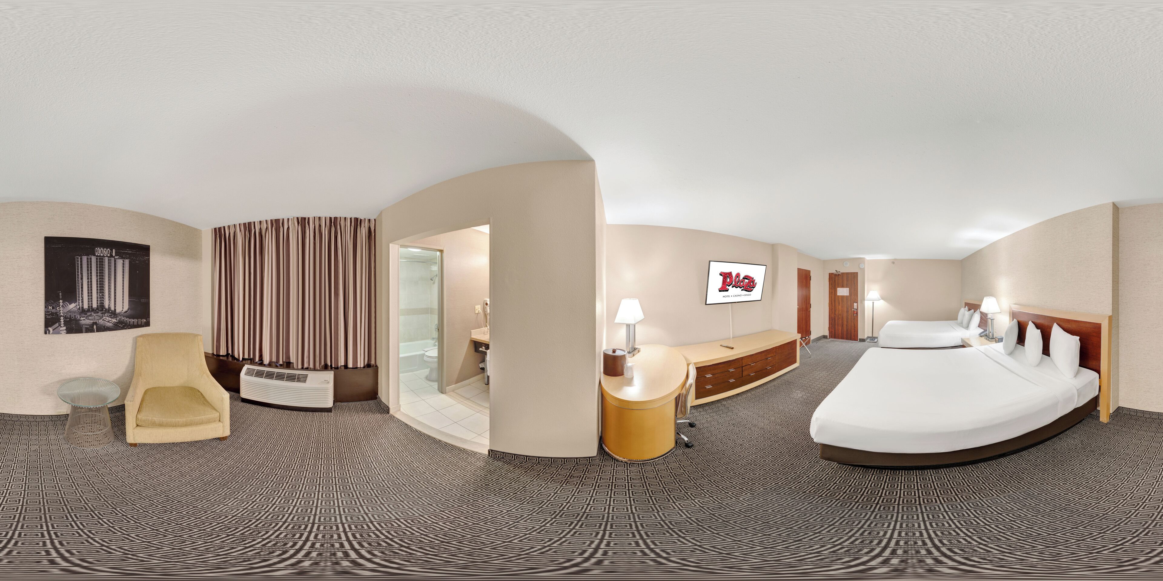 Premium bedding, in-room safe, desk, laptop workspace. Plaza Hotel & Casino