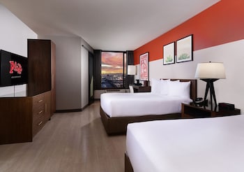 Luxe Room | Premium bedding, in-room safe, desk, laptop workspace at Plaza Hotel & Casino