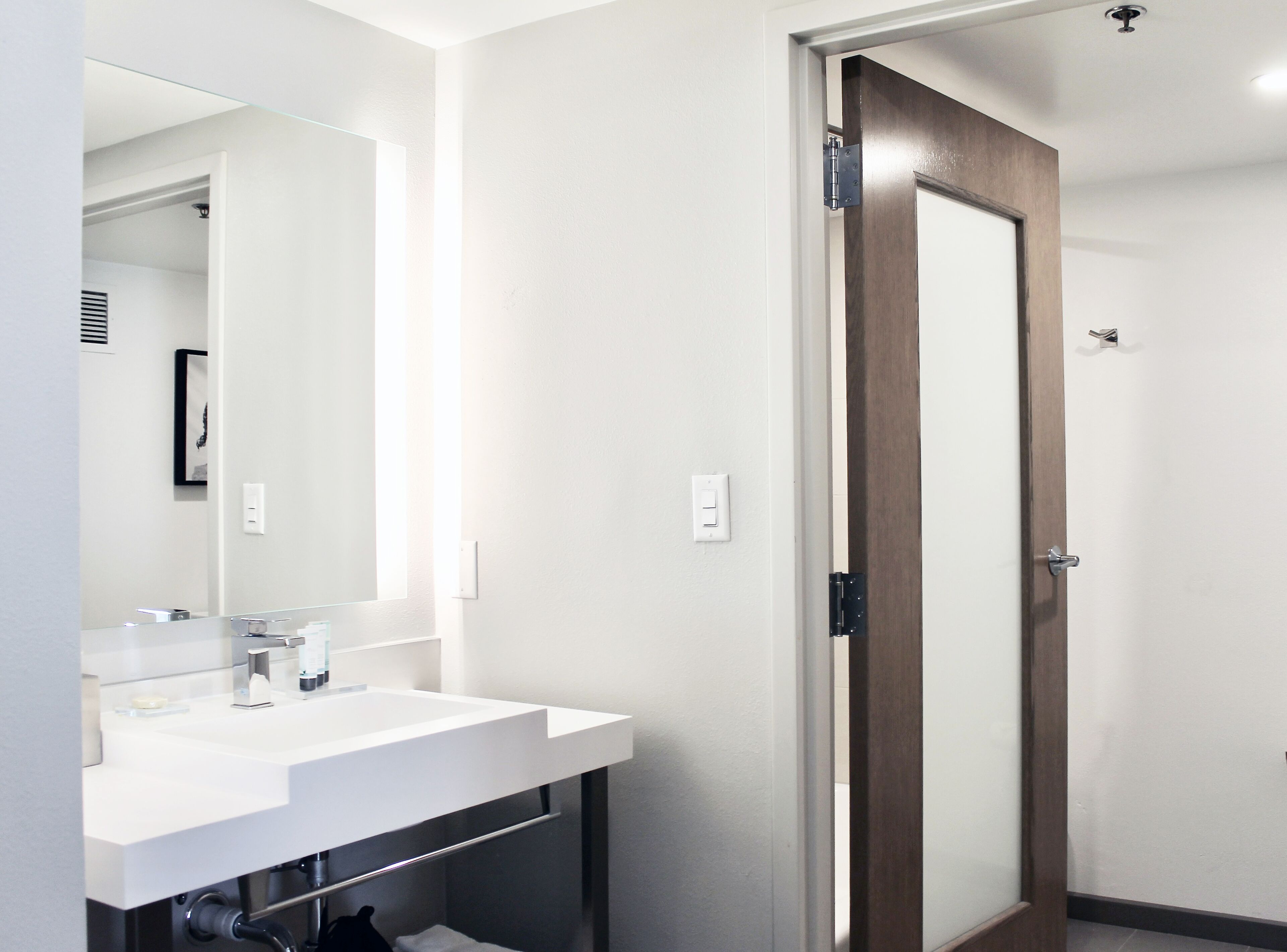 shower, designer toiletries, hair dryer, towels