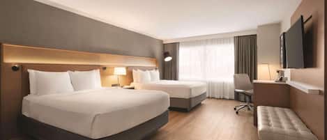 Ropa de cama de alta calidad y caja de seguridad en la habitación