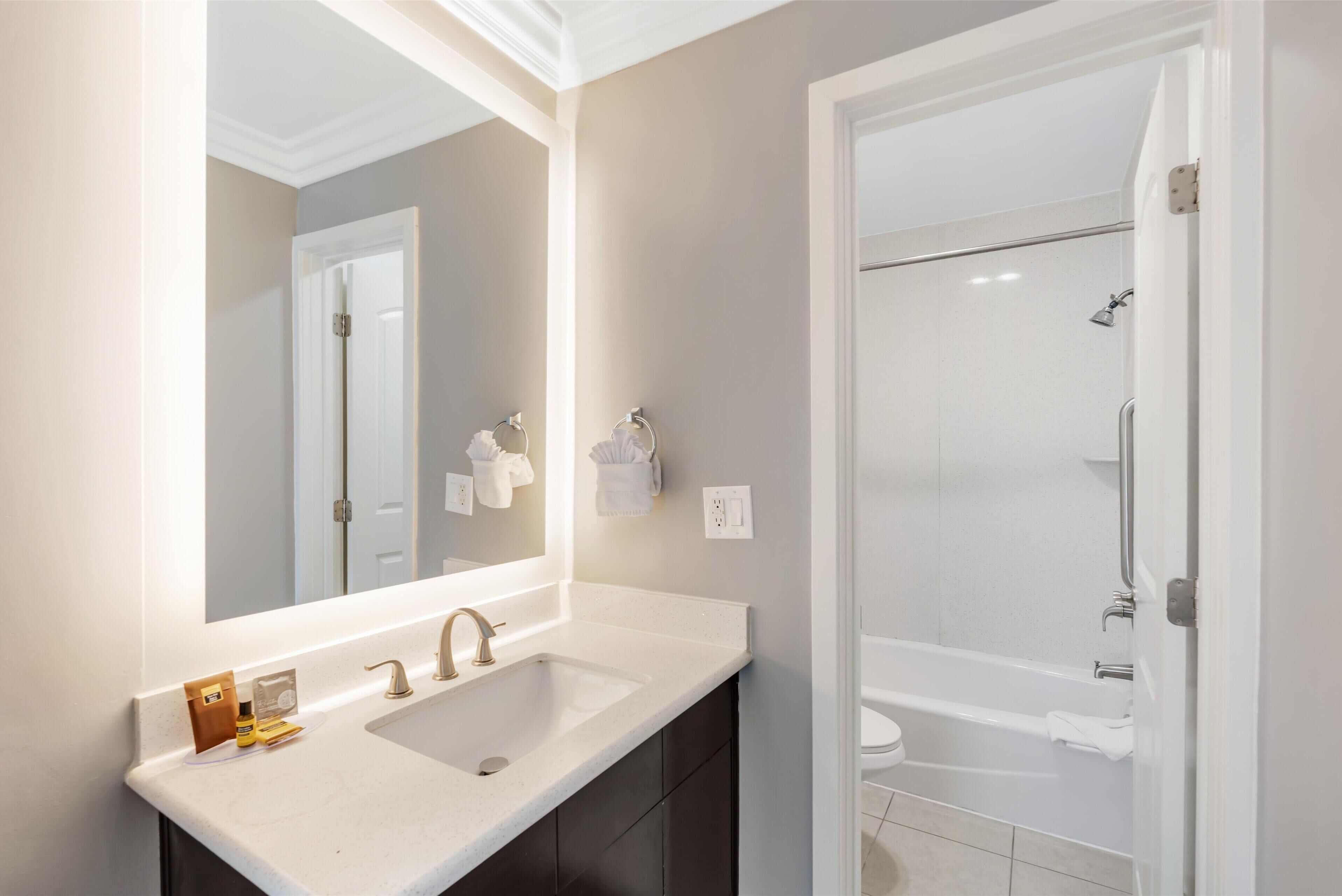 standard room, 1 king bed, refrigerator & microwave, corner | bathroom | free toiletries, hair dryer, towels