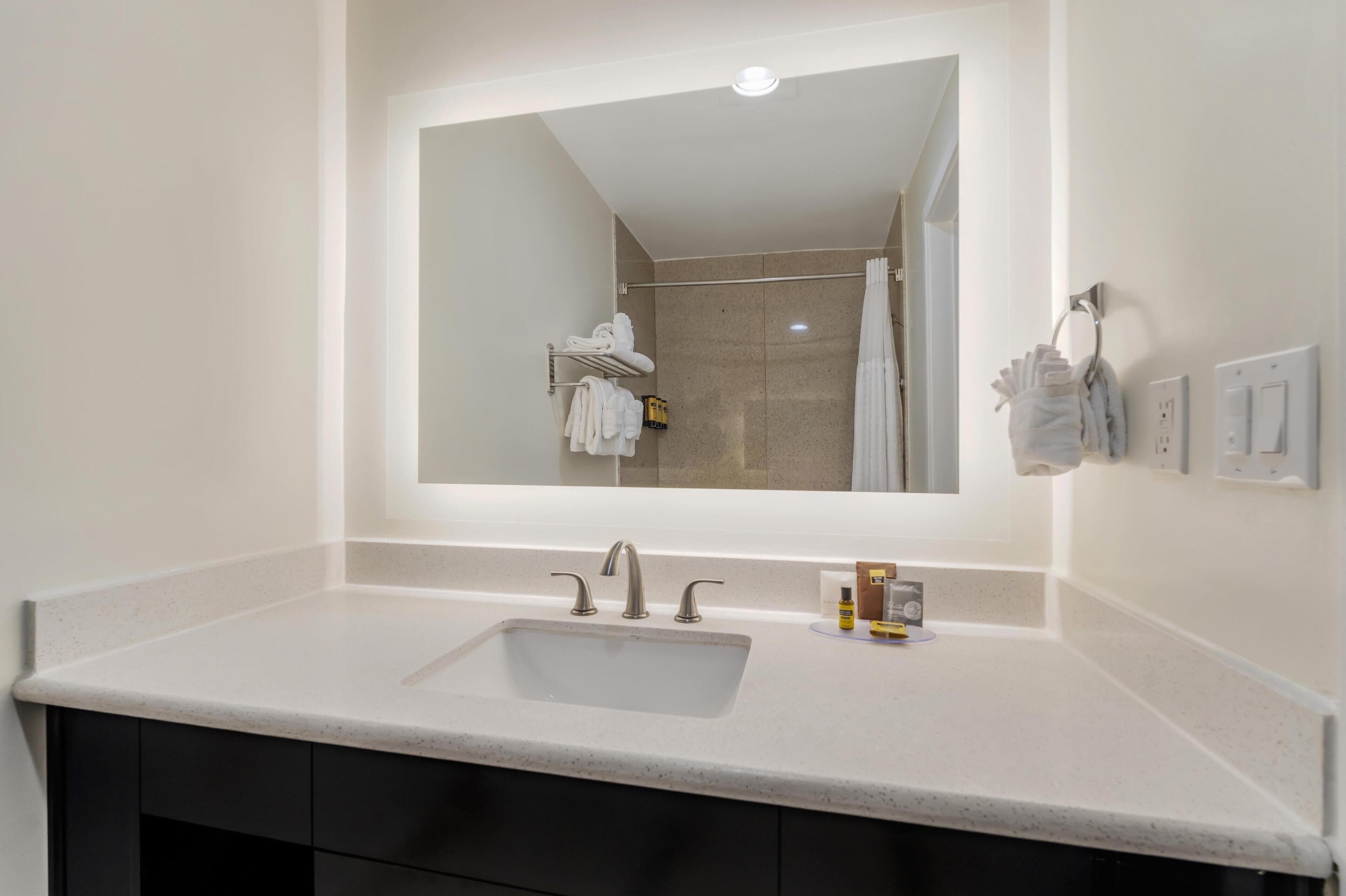 standard room, 2 queen beds, refrigerator & microwave, corner | bathroom | free toiletries, hair dryer, towels