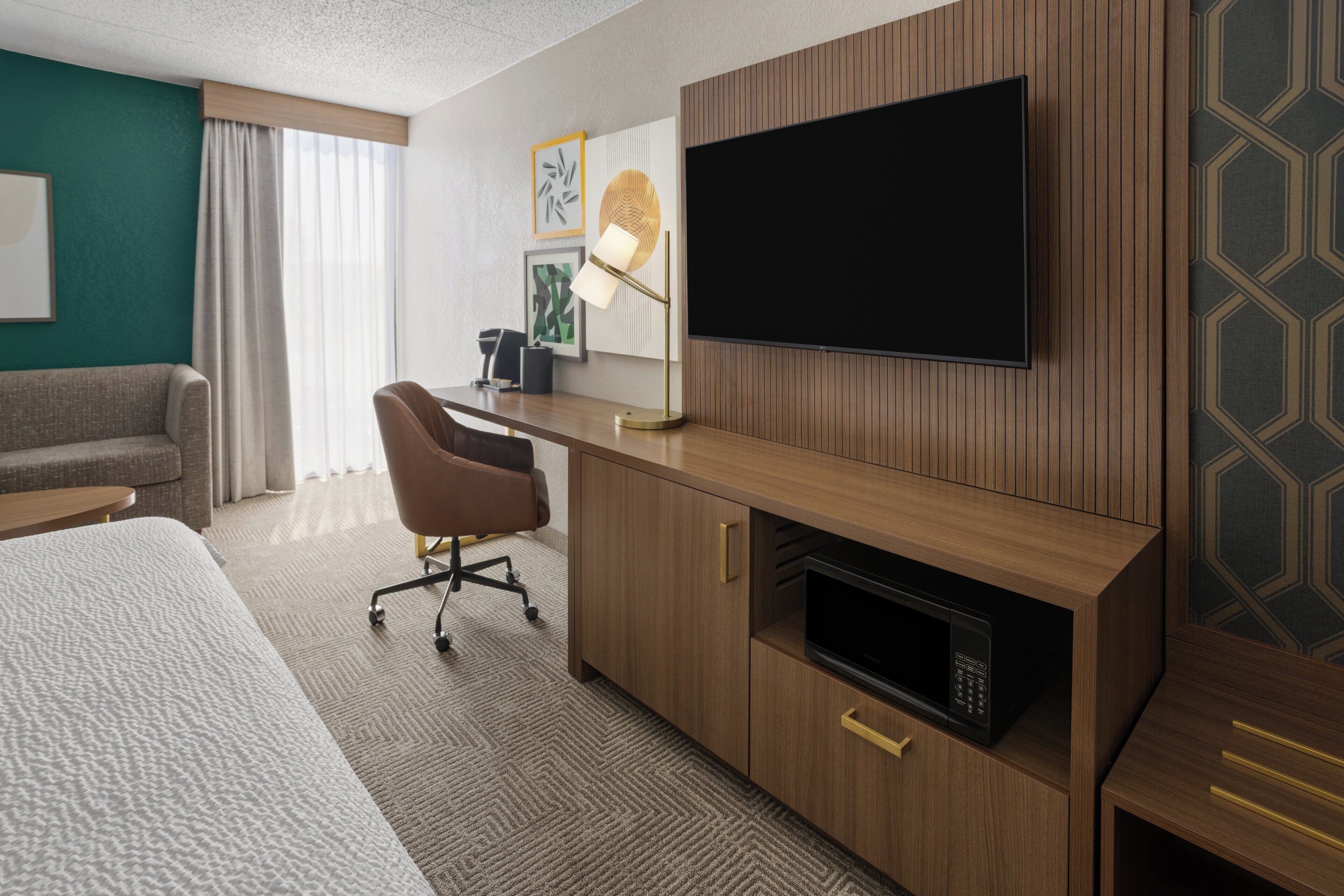 Desk, laptop workspace, blackout drapes, iron/ironing board