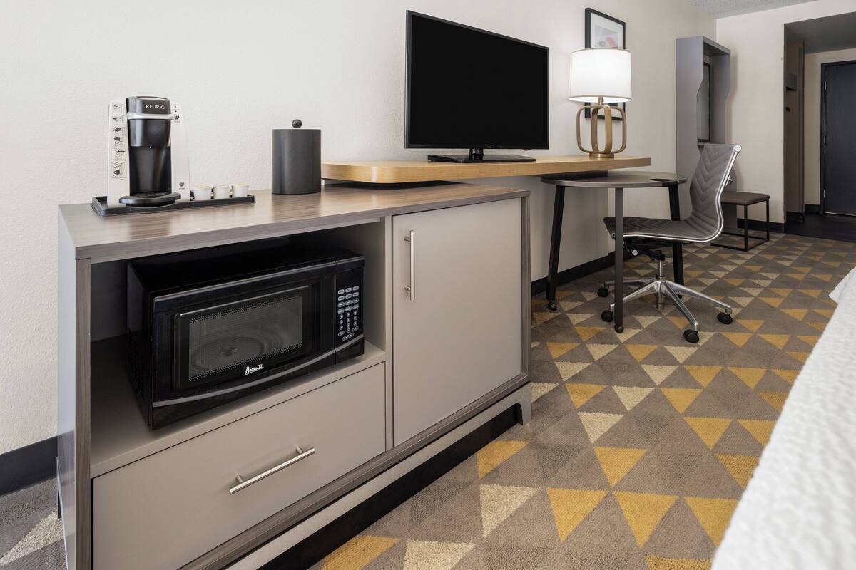 Desk, laptop workspace, blackout curtains, iron/ironing board