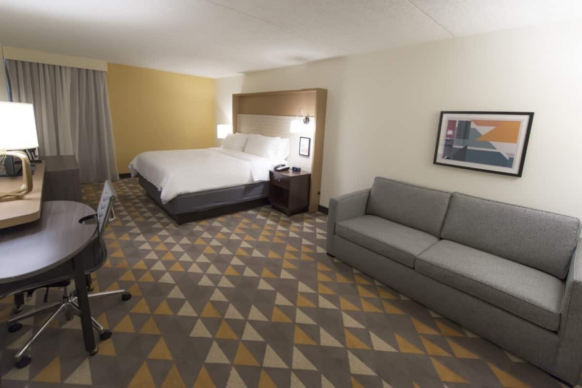 Desk, laptop workspace, blackout drapes, iron/ironing board