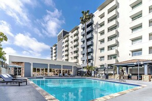 Outdoor pool, open 8:00 AM to 10:00 PM, pool umbrellas, sun loungers