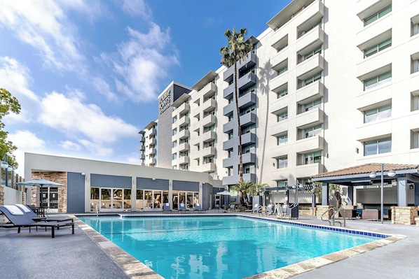 Outdoor pool, open 8:00 AM to 10:00 PM, pool umbrellas, sun loungers