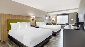A hotel room with two beds, a desk, and a chair. - Country Inn & Suites by Radisson, Atlanta Airport South, GA (College Park)