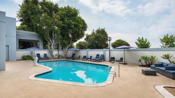 Outdoor pool, open 7:00 AM to 10:00 PM, pool umbrellas, sun loungers