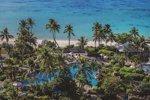 4 outdoor pools, open 9:00 AM to 7:00 PM, pool umbrellas