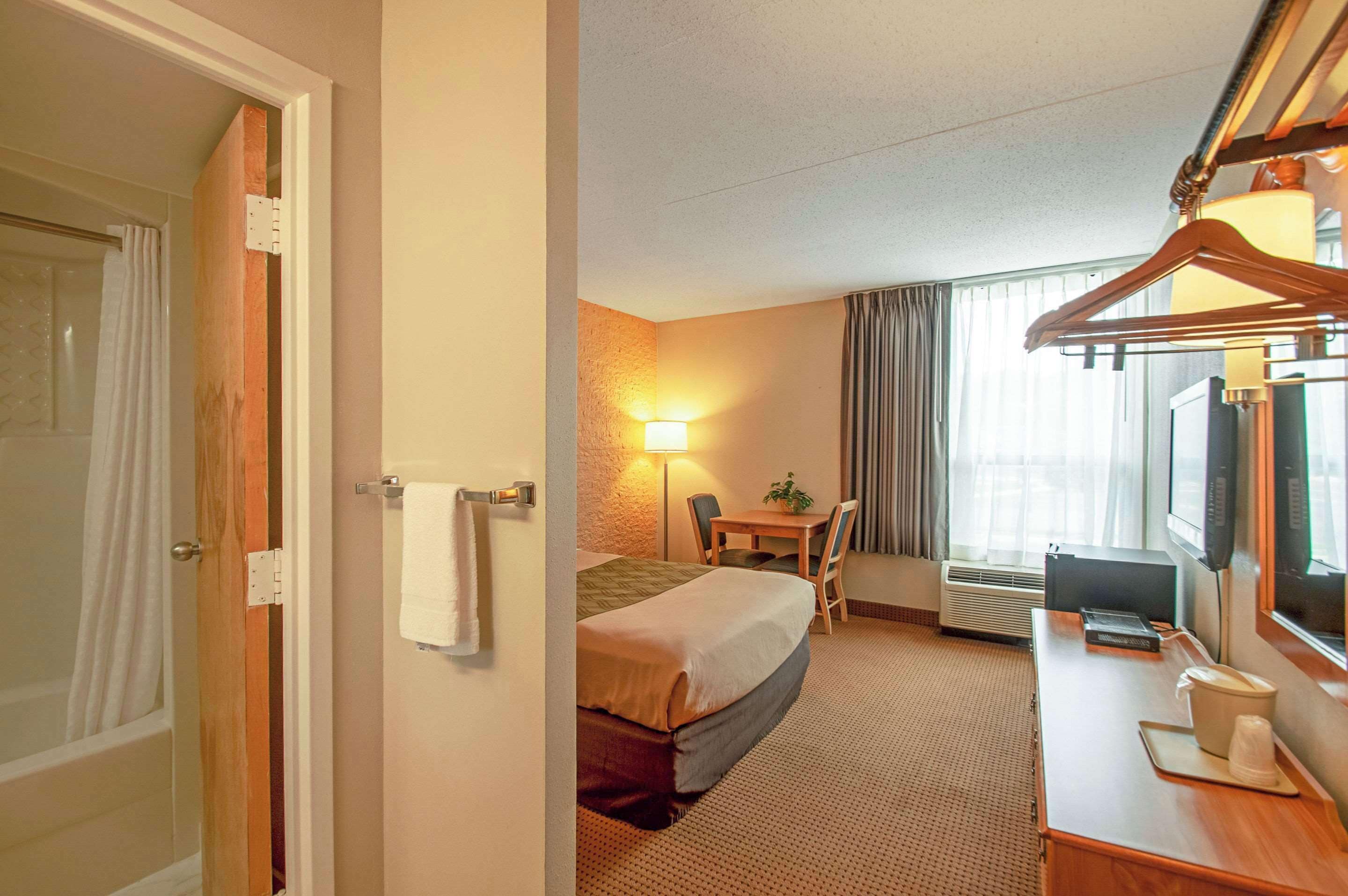 desk, blackout curtains, iron/ironing board, cots/infant beds