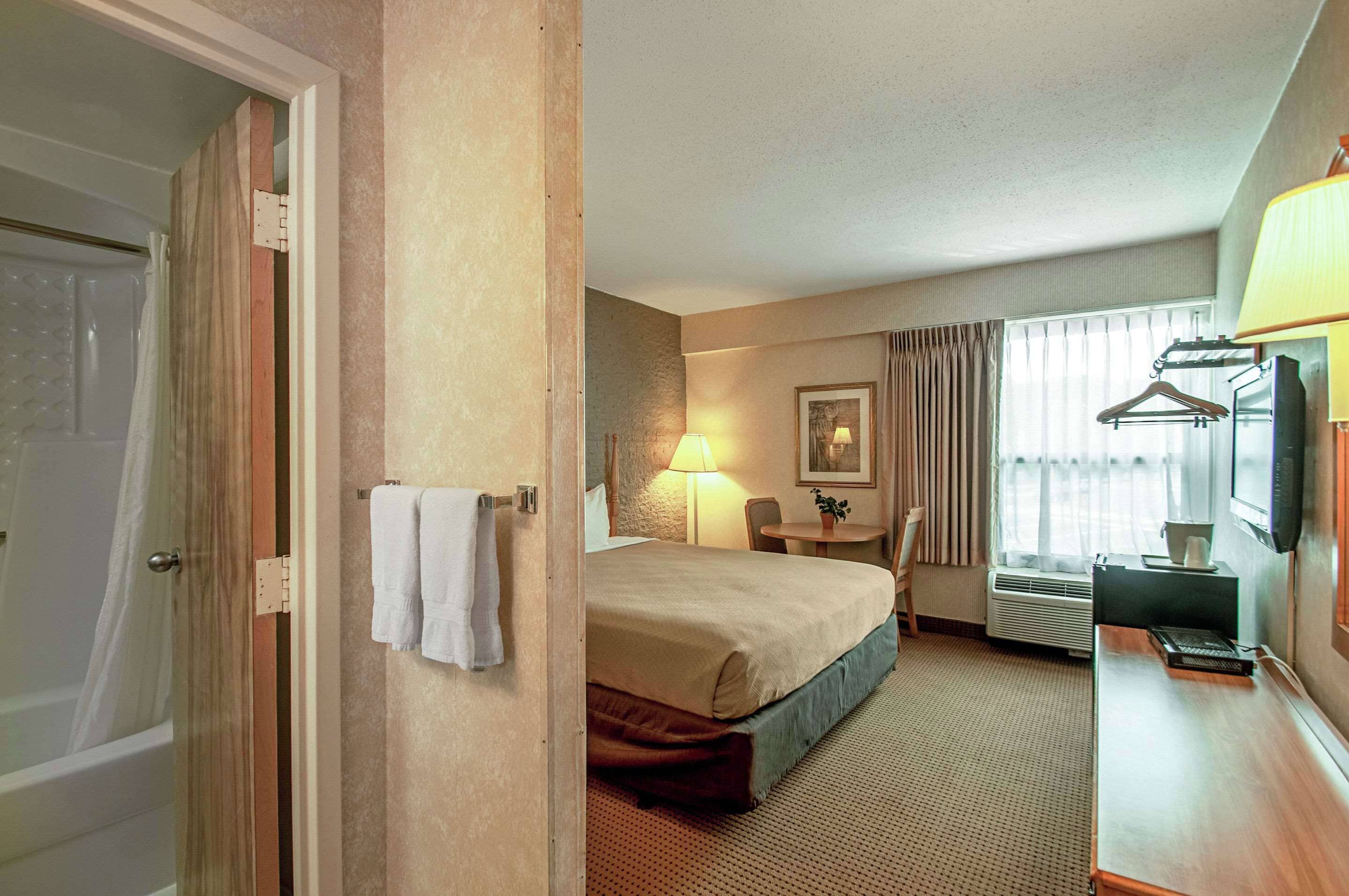 desk, blackout curtains, iron/ironing board, cots/infant beds