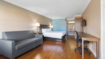 Chambre Deluxe, 1 très grand lit, vue sur la piscine | Literie de qualité, coffre-fort, décor unique, ameublement unique