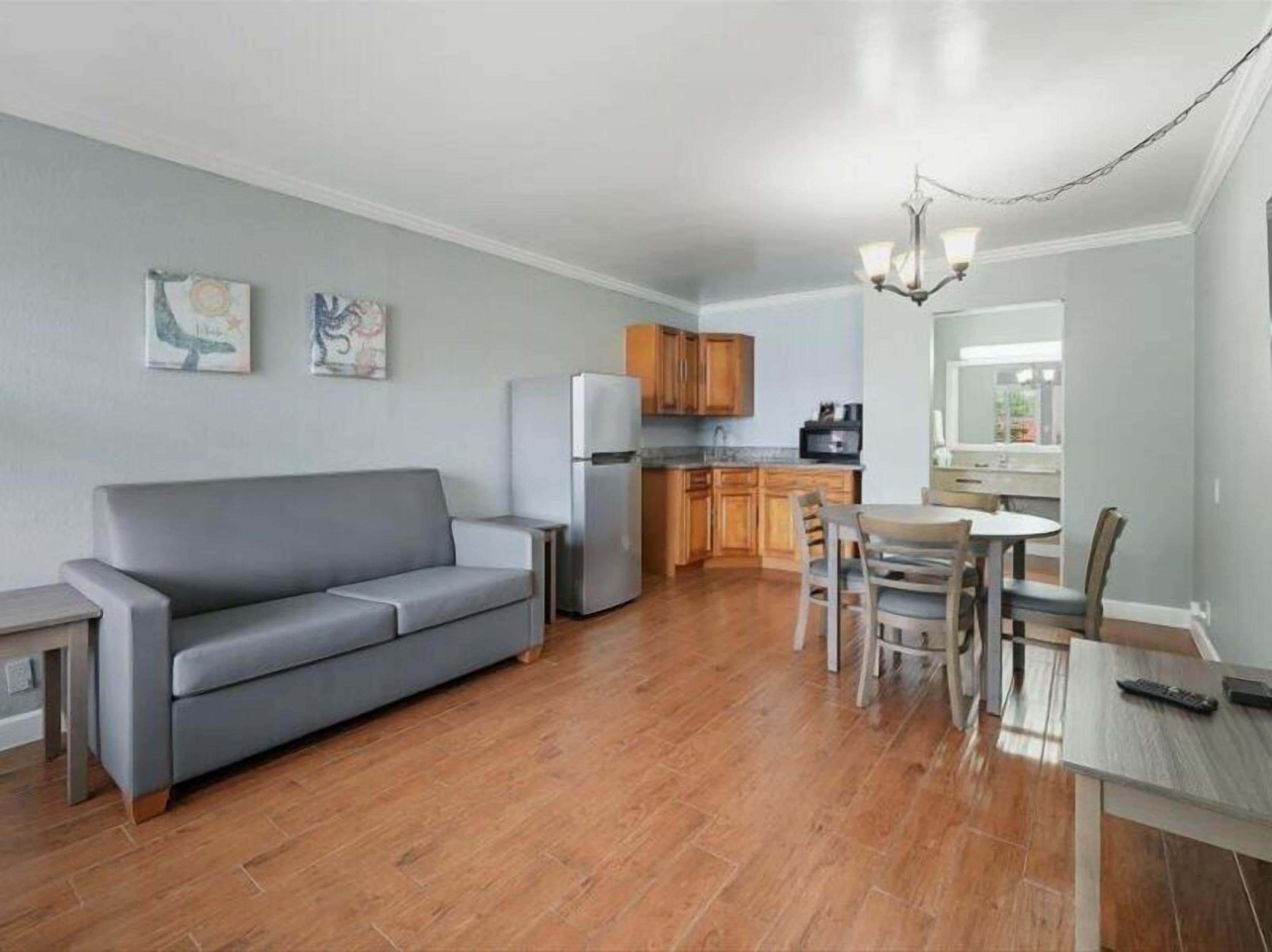 Grand Suite, 1 Bedroom, Pool View | Living area | 43-inch Smart TV with cable channels, TV, Netflix