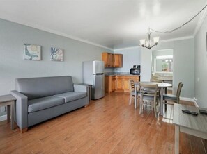 Grand Suite, 1 Bedroom, Pool View | Living area | 43-inch Smart TV with cable channels, TV, Netflix