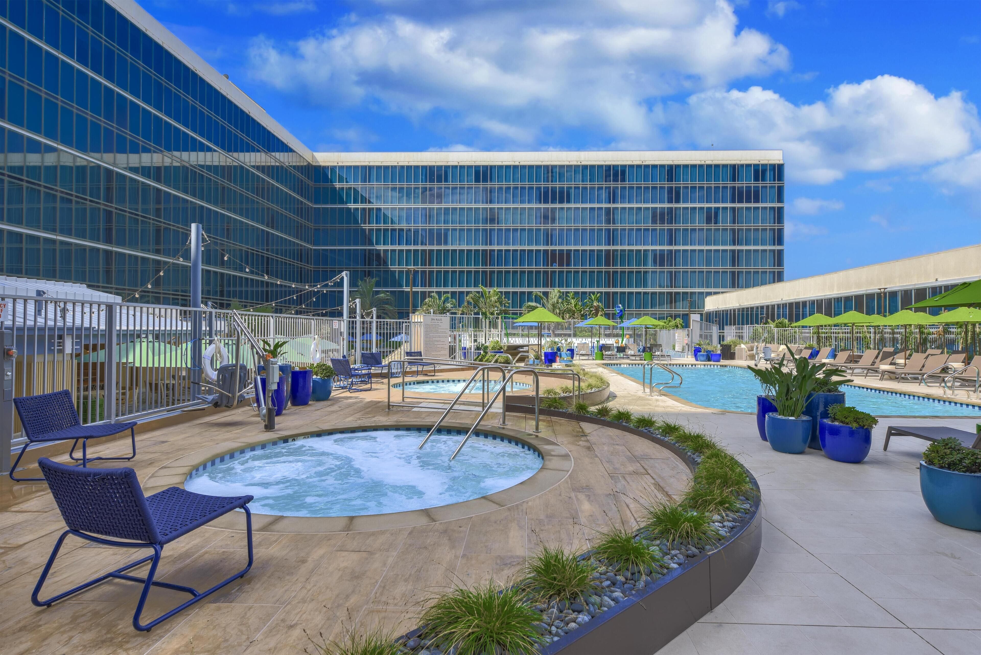 Outdoor pool, free pool cabanas, pool umbrellas