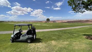 Guests can enjoy a serene golf cart ride through the open landscape.