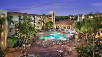 2 outdoor pools, open 7:00 AM to 10:00 PM, pool umbrellas, sun loungers