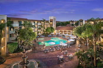 2 outdoor pools, open 7:00 AM to 10:00 PM, pool umbrellas, sun loungers at Embassy Suites by Hilton Scottsdale Resort