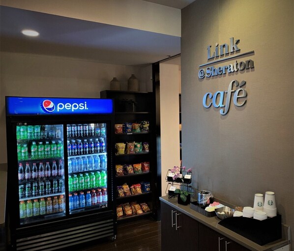 A Link @ Sheraton cafe with a Pepsi refrigerator and snack shelves. - Sheraton Lisle Naperville Hotel (Lisle)