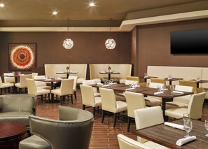 Enjoy a stylish dining experience with comfortable seating and modern decor.