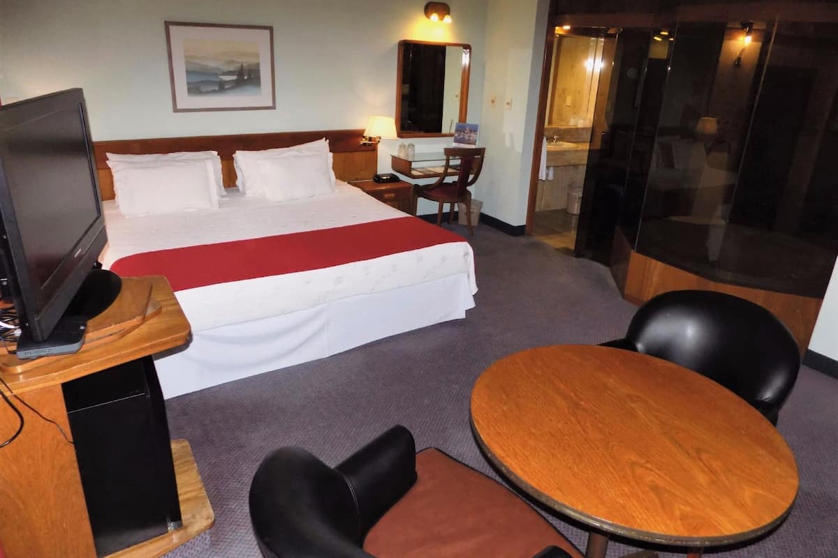Deluxe Suite, Terrace, City View | Minibar, in-room safe, desk, laptop workspace