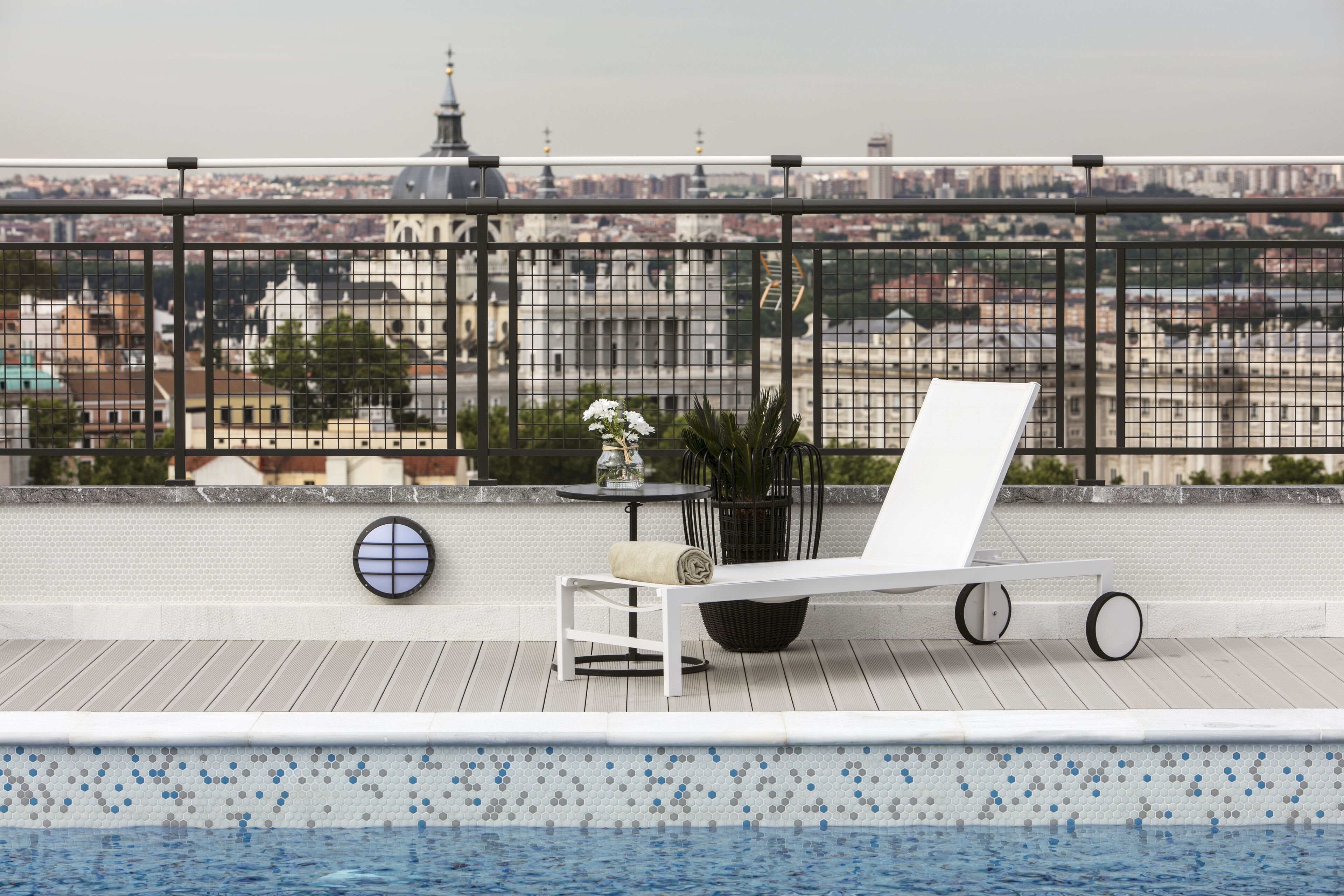 outdoor pool, pool loungers, lifeguards on site