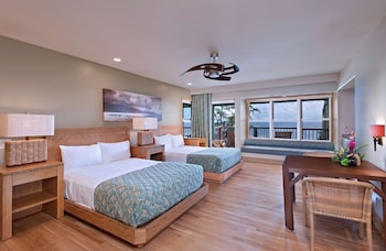 A spacious indoor area with high ceilings, large windows, and multiple seating arrangements. at Hana-Maui Resort, a Destination by Hyatt Residence