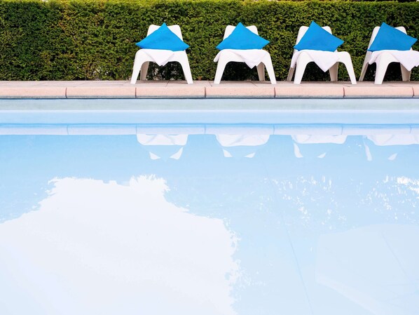 Seasonal outdoor pool, pool umbrellas, pool loungers