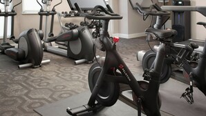 A gym with stationary bikes, treadmills, and dumbbells. - Residence Inn By Marriott San Antonio Airport/Alamo Heights (San Antonio)