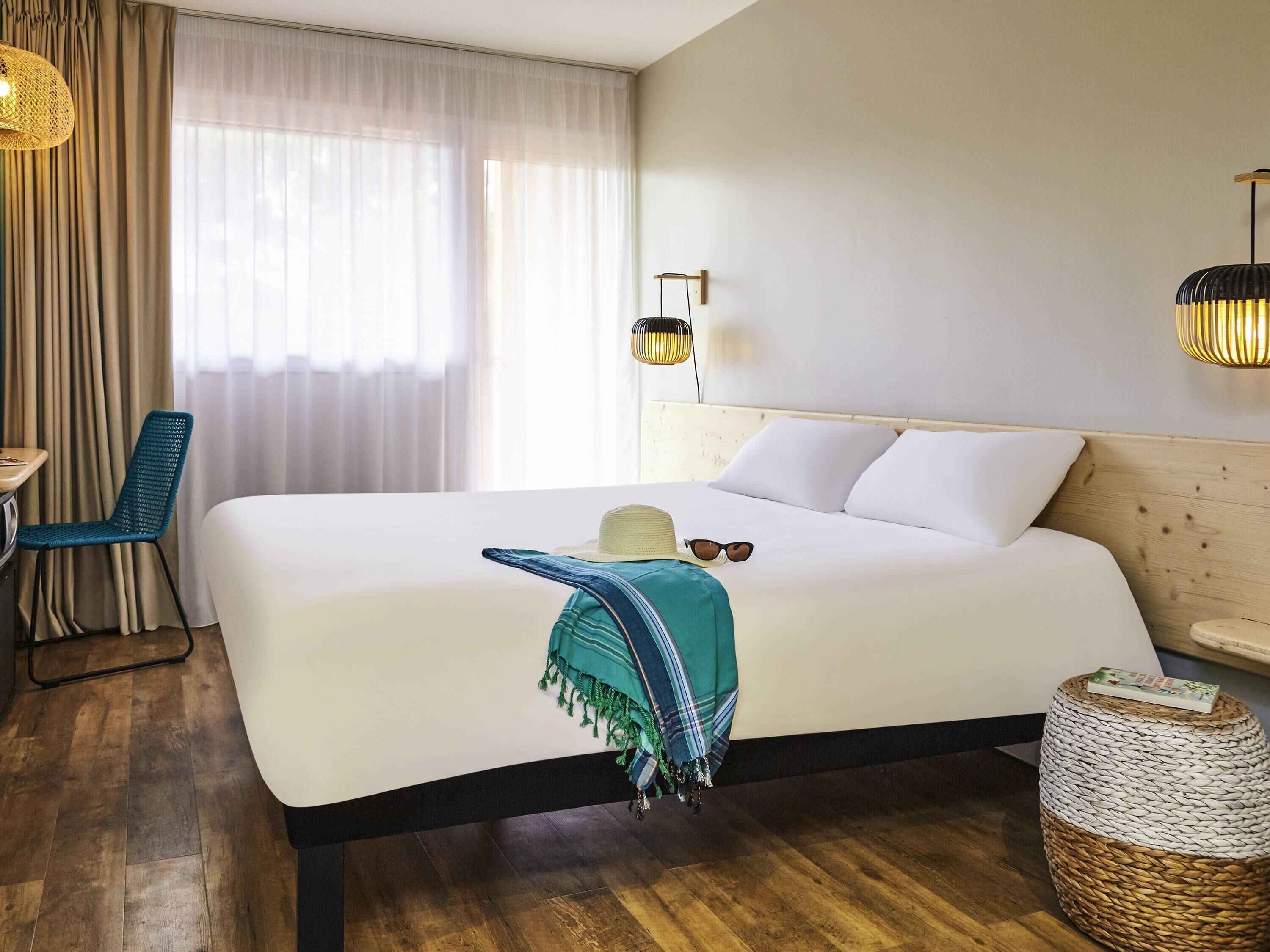 Standard Double Room, Garden View (with Loggia) | In-room safe, desk, laptop workspace, blackout drapes